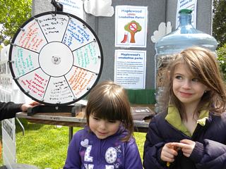 Two bashful kids pose with smokefree parks information